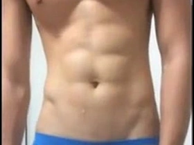 Young Asian man with a six pack, solo pleasure