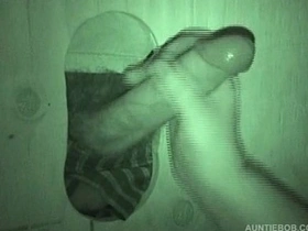 Big dick gets sucked in public glory hole scene