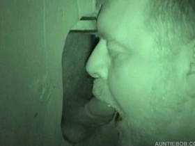 Public restroom hidden camera captures Glory Hole cock sucking scene.