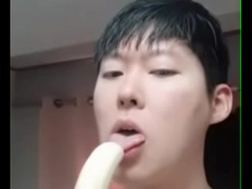 A cute gay enjoying sucking on his favorite fruit