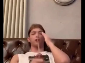 Gay Asian man has a hard dick while pissing.