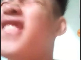 Young Asian boy shows off his big cock in solo pleasure.