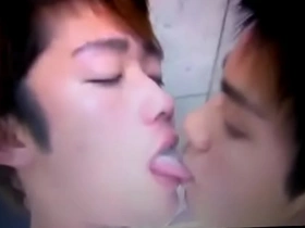 Hot gay Asian boys kissing and sucking each other’s tongues.