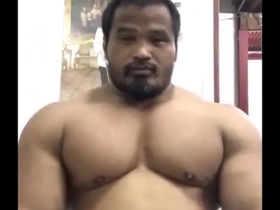 Muscular Thai man in a beefy bodybuilding competition