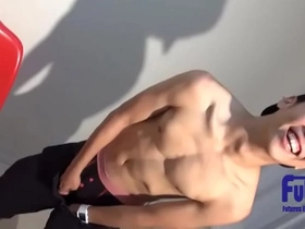 Gay sports club member flaunts his large penis on camera.
