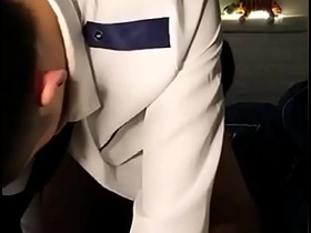 Two handsome flight attendants have sex with each other.