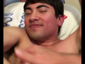 Slapping and fingering in a gay porn video with an older and younger man.